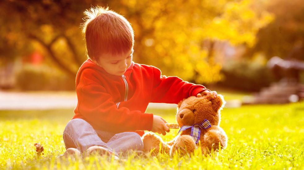 Free events July boy with teddy bear in summer